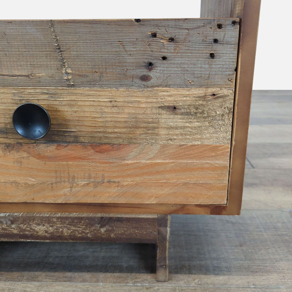 3. Close-up of drawer front on the West Elm rustic wood end table, highlighting wood texture and black knob.