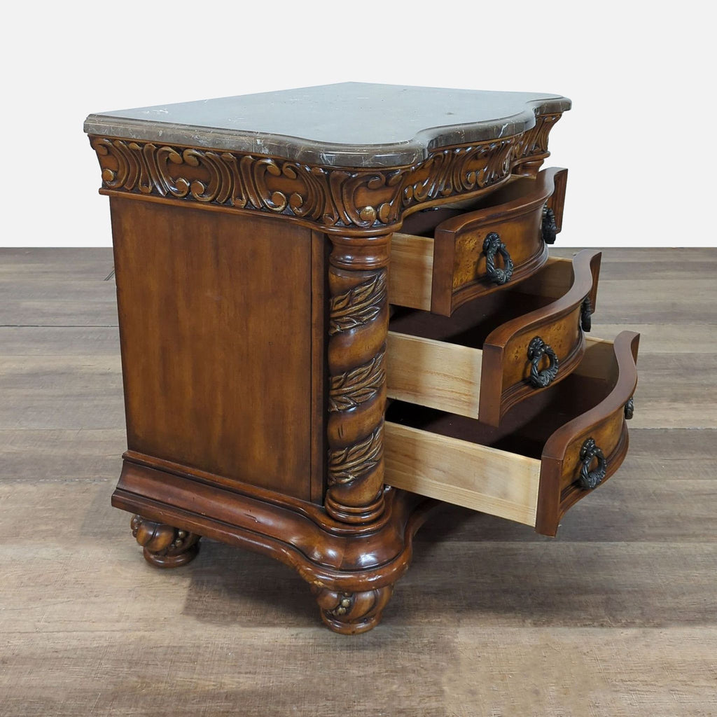 2. Reperch end table shown at an angle, highlighting open curved drawers and intricate carved wood details.