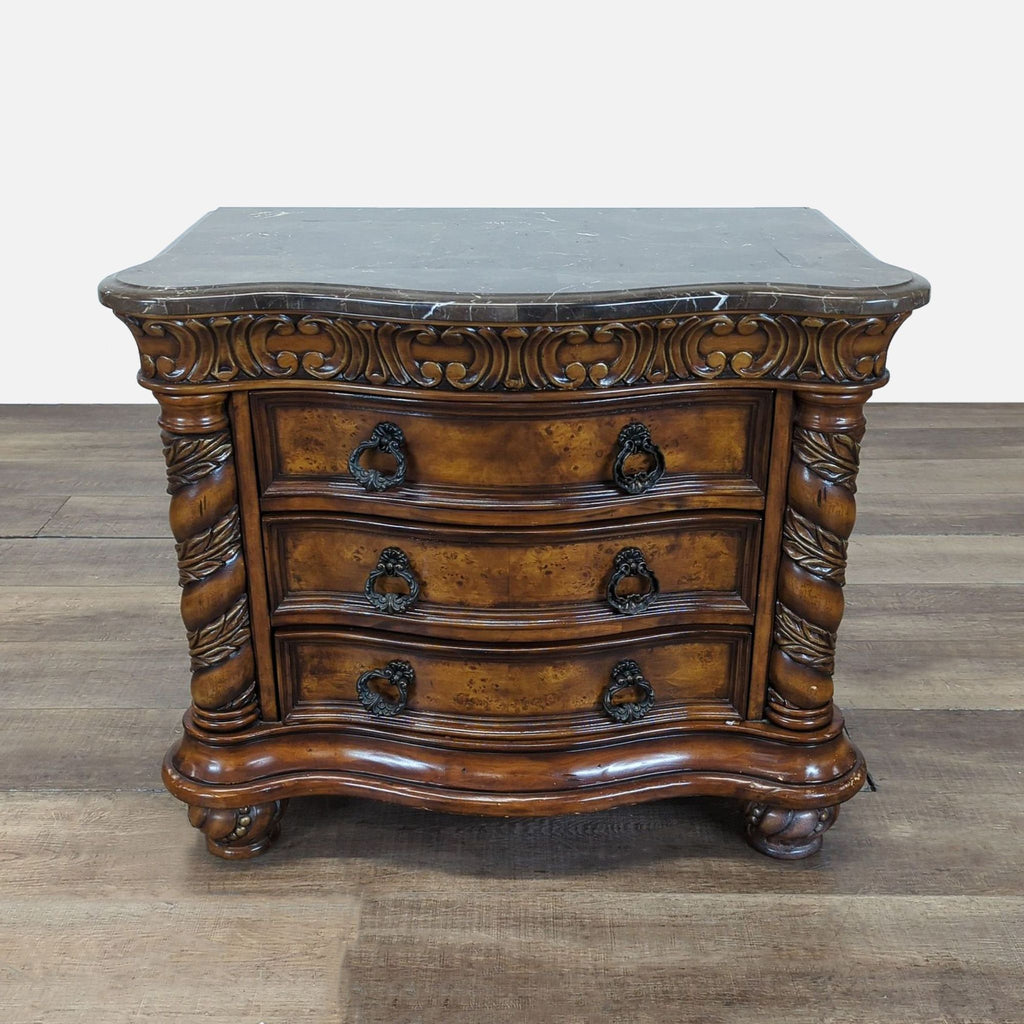 1. Ornate Reperch end table with a marble top, three drawers, detailed carvings, and a classic wood finish.