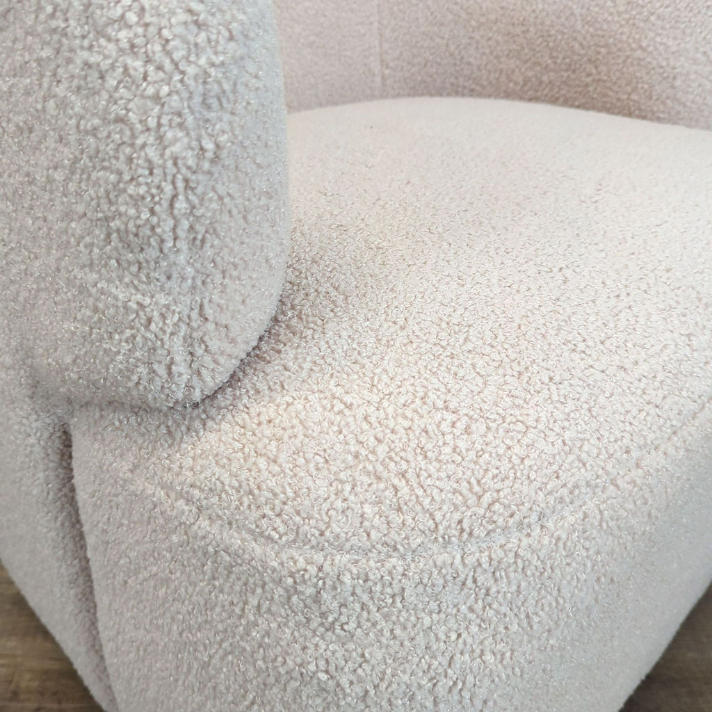 Close-up detail of the Amazon lounge chair's soft cream Sherpa upholstery, showing fabric texture.