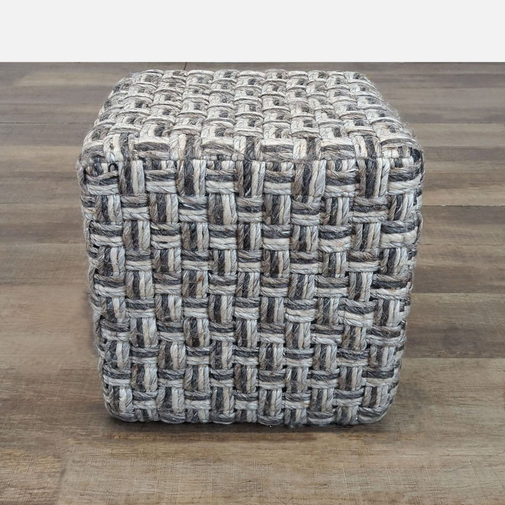 1. Square hassock ottoman with chunky hand-woven basket weave in charcoal, camel, gray, and cream tones by Surya.  