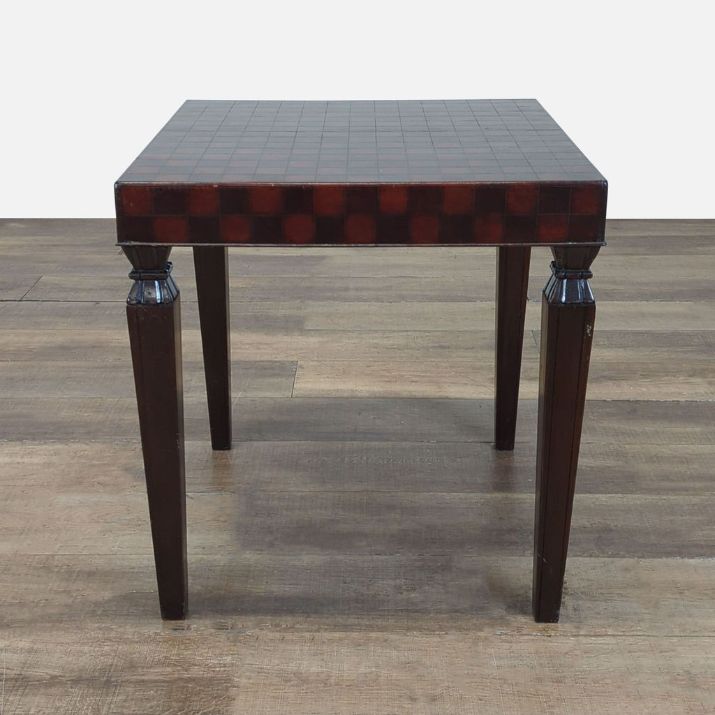 1. Square South Cone end table with a checkerboard patterned top and four carved wooden legs on a wood floor.