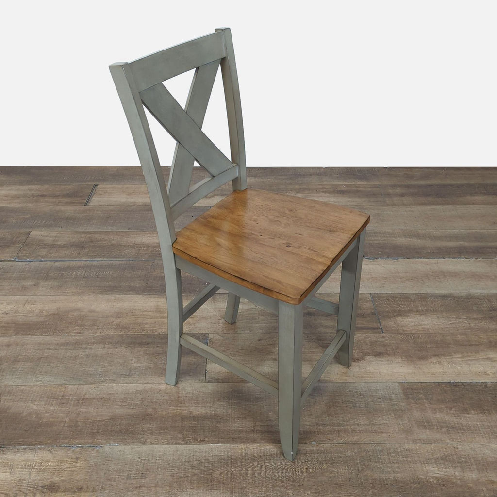 3. Side angle of a Winners Only, Inc. stool with an X-back, gray frame, and wood seat from the Stools, Ottomans & Benches category.