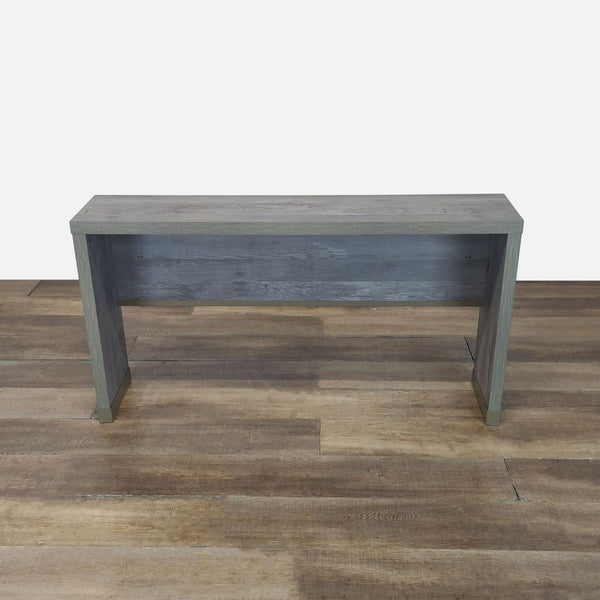 1. Reperch side and console table with a minimalist rectangular design in a gray wood finish on wooden flooring.
