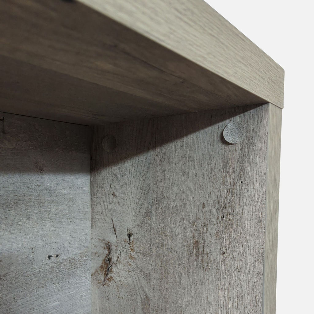 3. Interior corner of the Reperch side table, showing wood grain, joinery, and subtle construction elements.