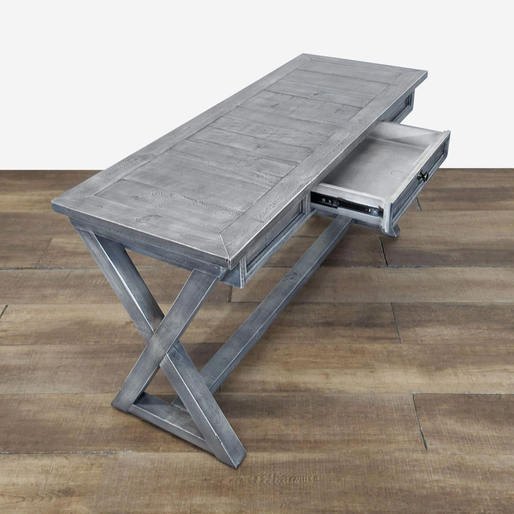 2. Angled view of Reperch side console table showing open drawer and sturdy cross-legged support.