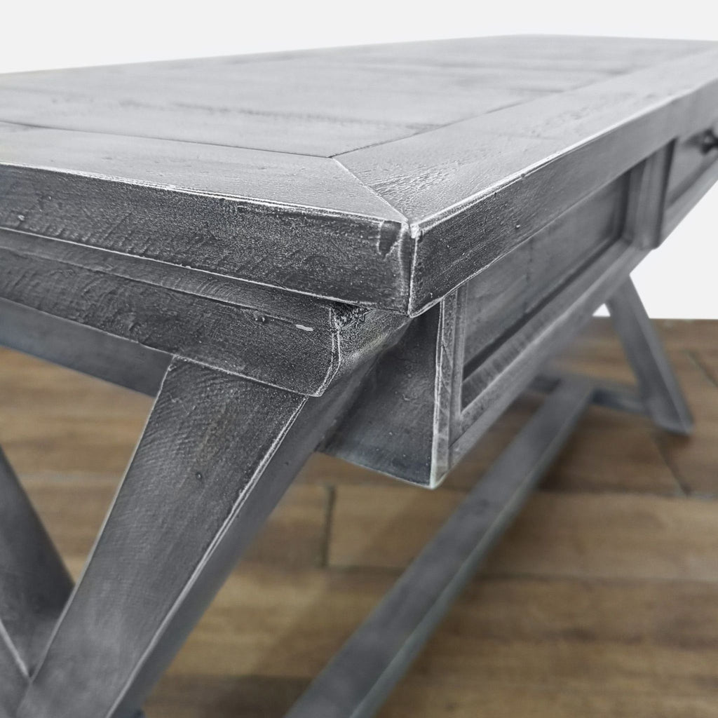 3. Close-up of the textured wood surface and detailed corner joinery of the grey Reperch console table.