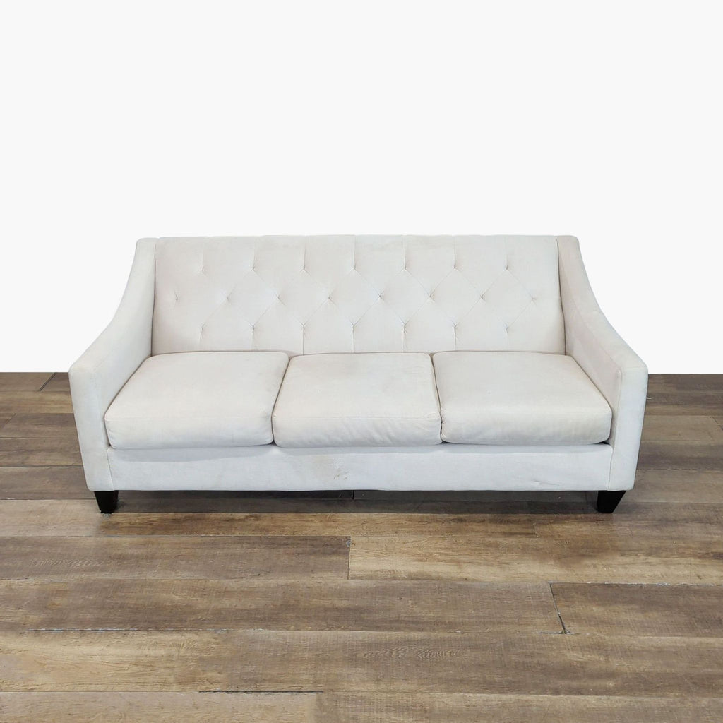 Front view of a Max Home Furniture Better by Design 3-seat sofa with pearl upholstery, diamond tufting, and sloped arms.  