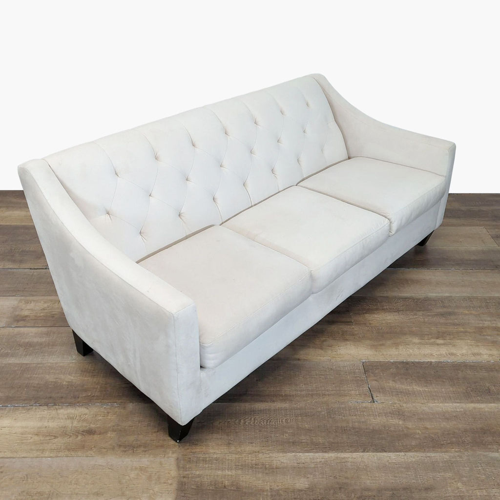 Angled view of a 3-seat sofa by Max Home Furniture Better by Design, showing pearl fabric, tufted back, and sloped arms.  