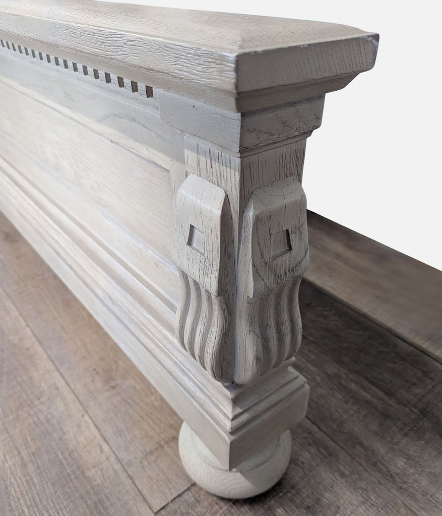 2. Close-up of hand-carved antique gray oak frame corner showing fluted detailing and sculpted corbels from Restoration Hardware.