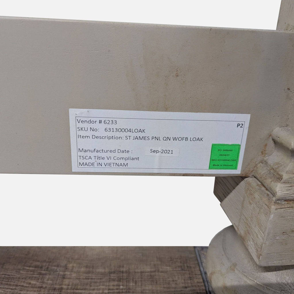 3. Product label on a Restoration Hardware antiqued gray oak frame, showing SKU, vendor info, and manufacturing date.