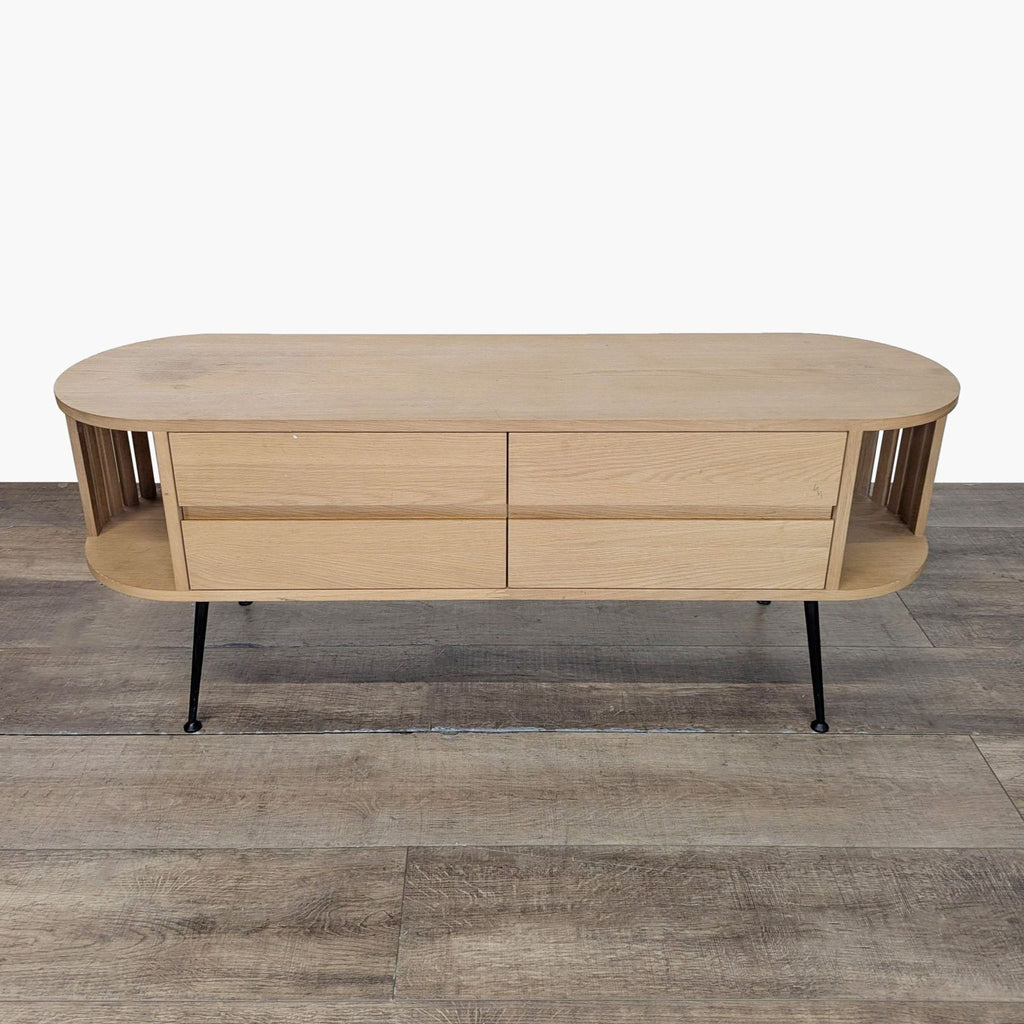 1. Joybird Mid-Century two-door cabinet with open corner shelves and metal legs, closed front view.