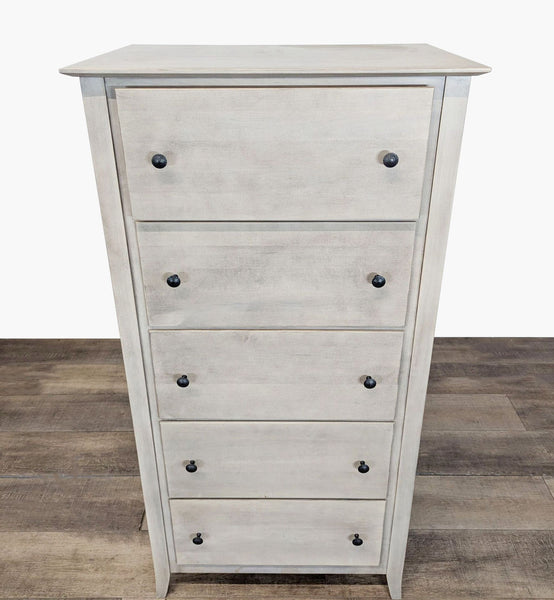 1. Light wood dresser with a glazed finish, featuring five drawers and black knobs, by Stuart David.