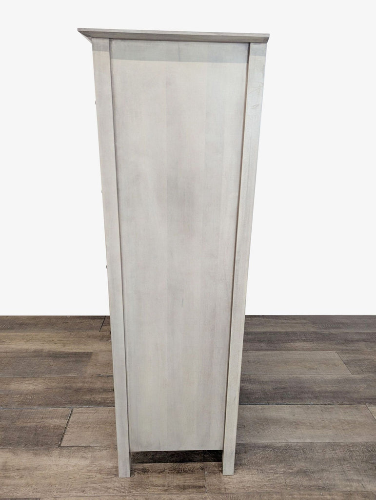 3. Side view of the Stuart David dresser, showing its solid wood construction and smooth glazed finish.