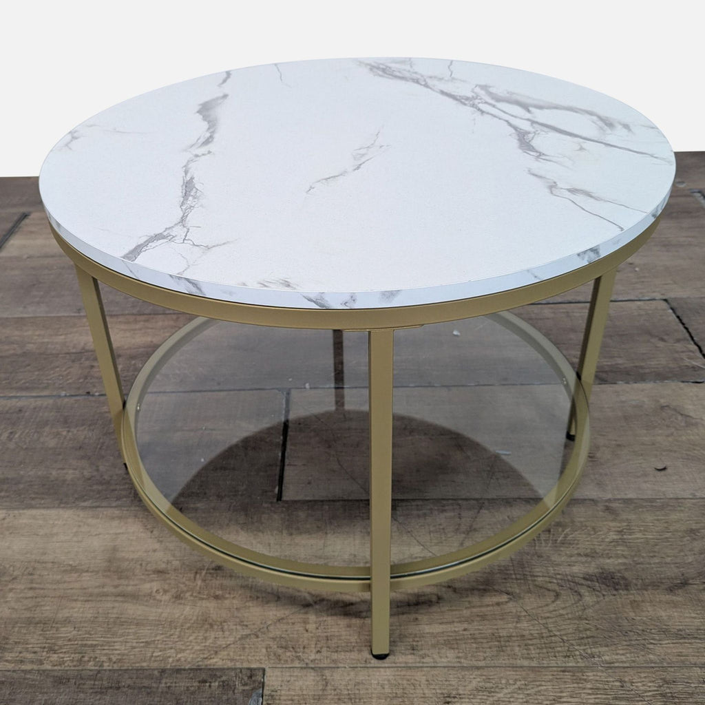 3. Round Vasagle coffee table with faux marble top, gold metal legs, and glass lower shelf for storage.