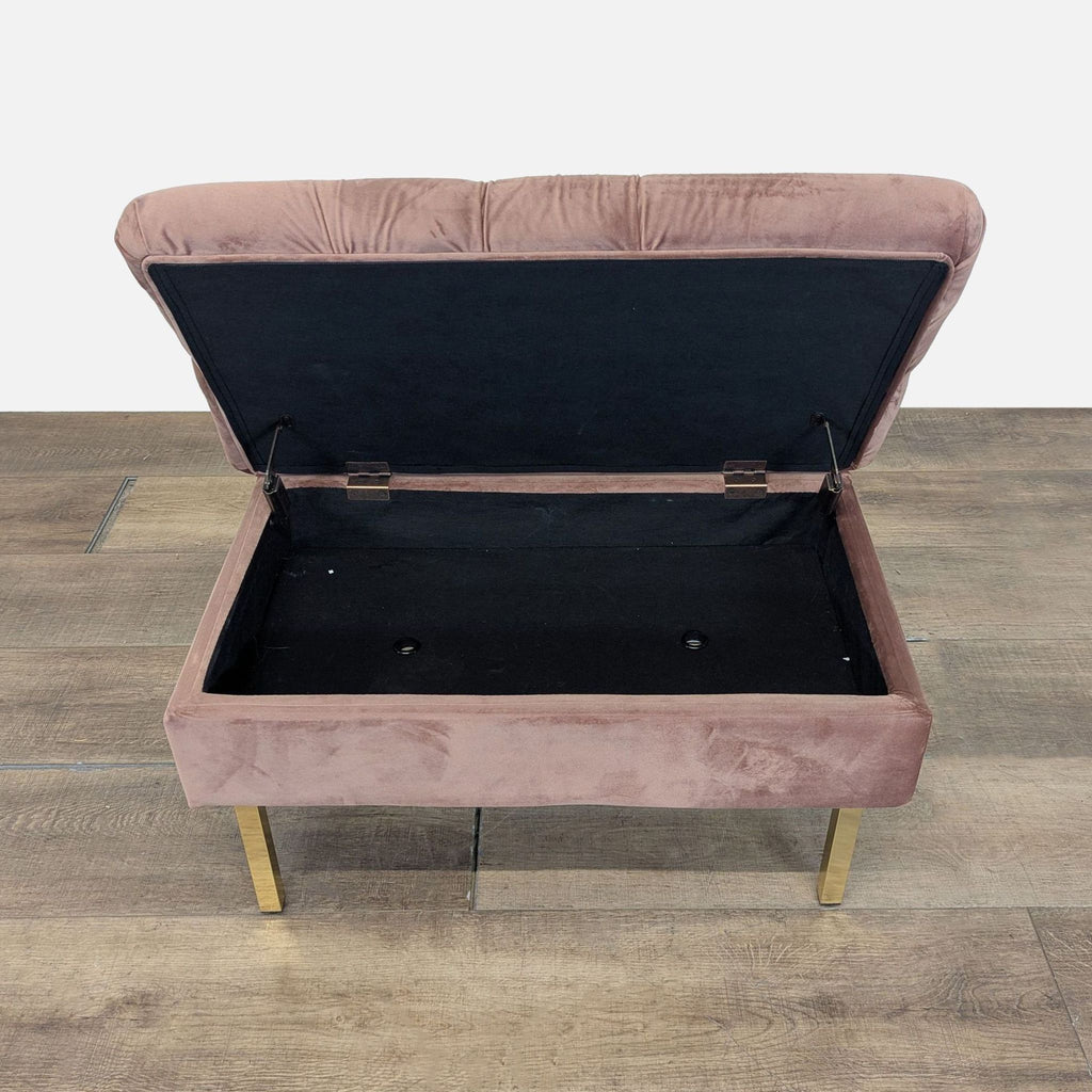 2. Storage ottoman by Reperch with the lid open, showing a black interior and velvet exterior.