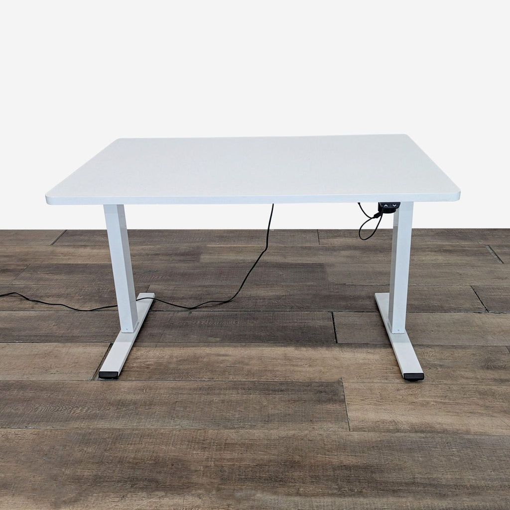 1. Reperch adjustable height standing desk with electric up and down controller, shown on wood flooring.  