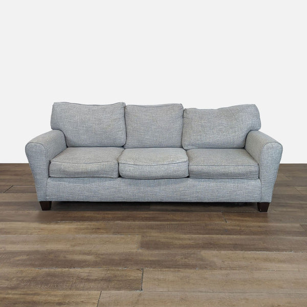 1. Light gray Wayfair 3-seat sofa with rolled arms, three cushions, and dark wooden legs, front view.