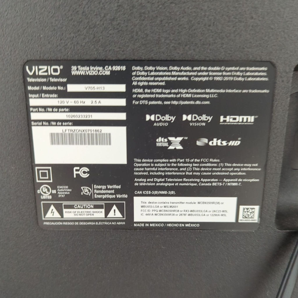 3. Close-up of the Vizio TV's back label showing model, serial number, and key technical information.