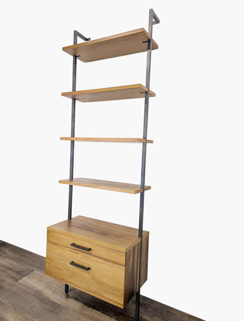 2. Angled side view of CB2 bookshelf, highlighting walnut shelves, metal frame, and bottom two-drawer storage.
