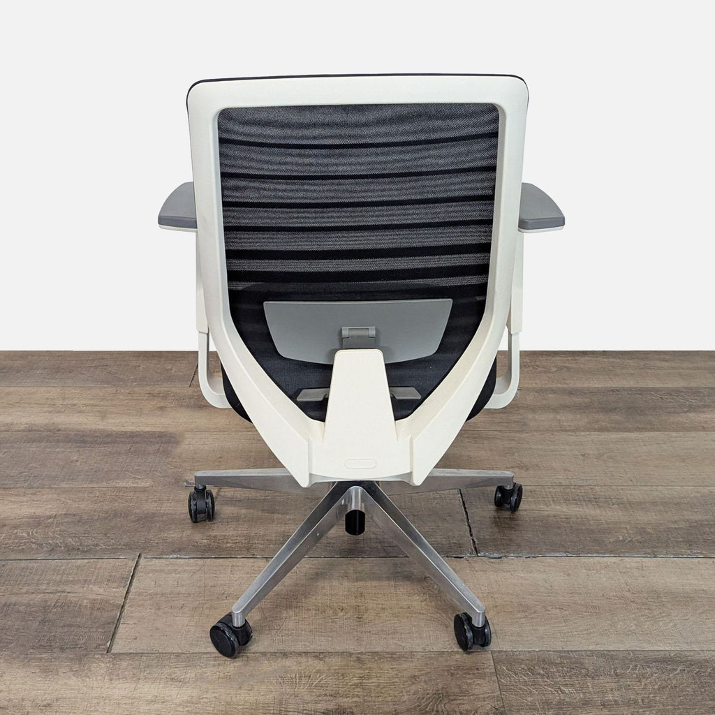 3. Rear angle of Bureau chair highlighting double-layered mesh back and adjustable lumbar support feature.
