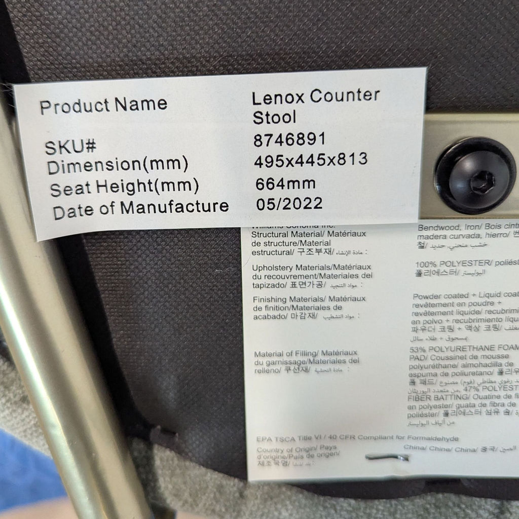 3. Product label for West Elm Lenox Counter Stool with dimensions, seat height, SKU, and manufacture date detailed.