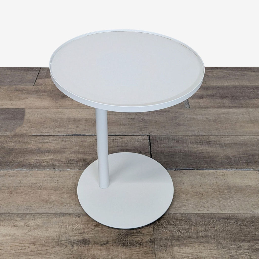 2. Minimalist Reperch console table in white, featuring a circular top and sturdy single leg.  