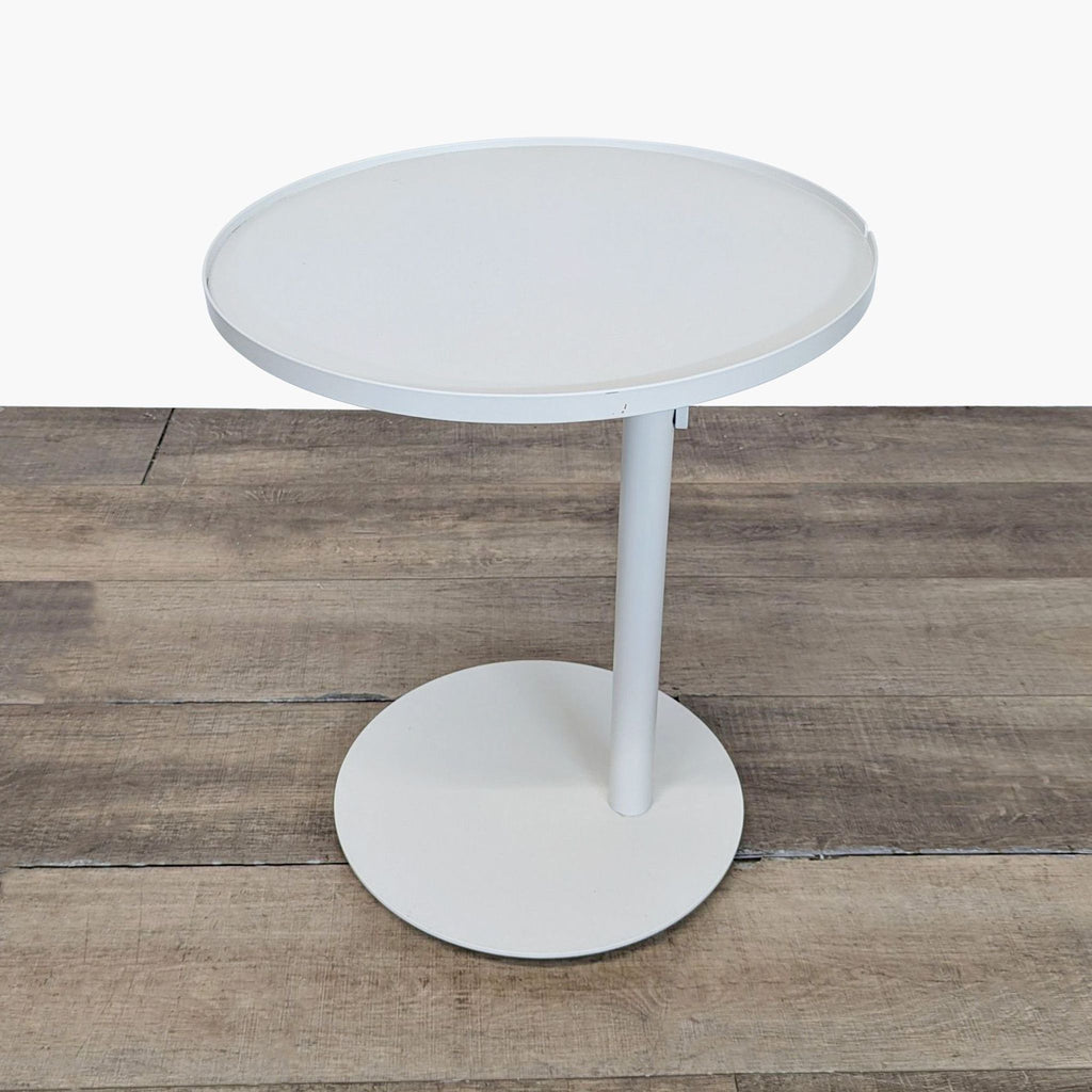 3. Sleek Reperch side table with round top and base, ideal for living spaces or as an accent piece.
