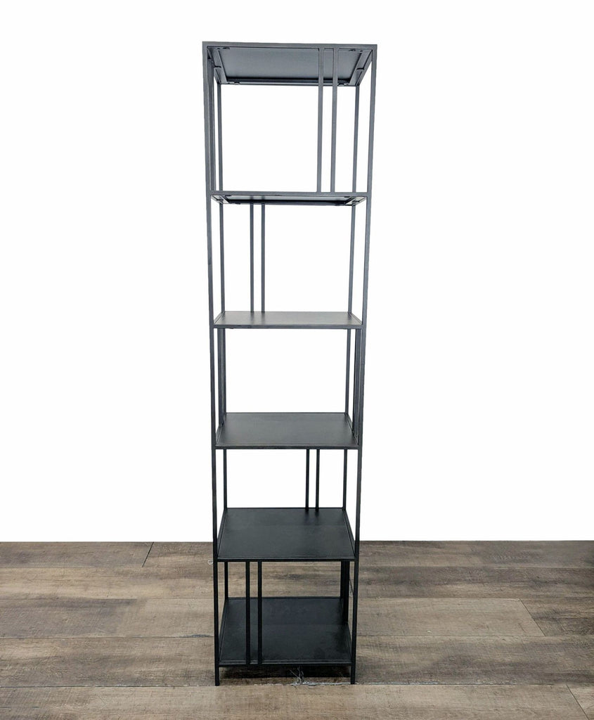 1. Minimalist West Elm bookshelf with slim metal frame and staggered shelves, shown on wooden floor.
