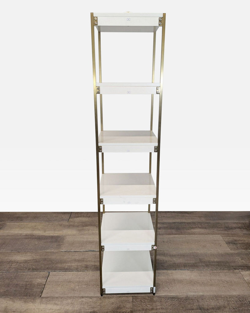 3. Minimalist bookshelf with gold-plated iron frame, hand-finished white shelves, perfect for modern interiors.