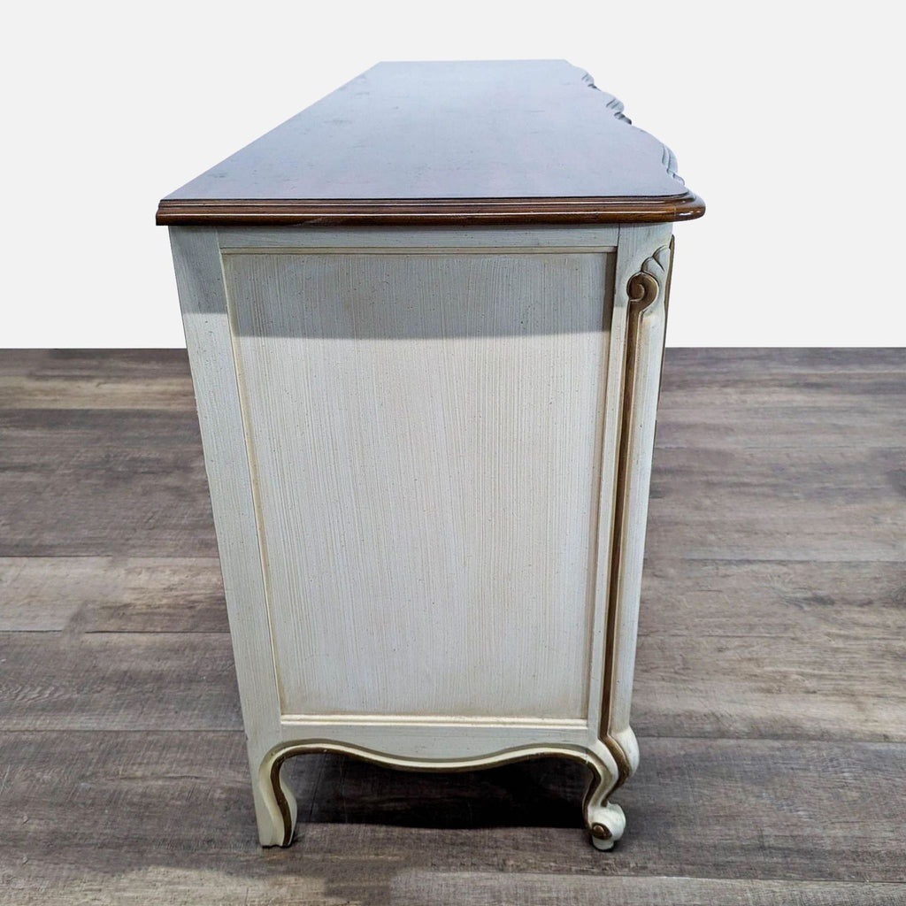 3. Side angle of Drexel Heritage dresser highlighting curved legs, textured finish, and subtle ornate accents.