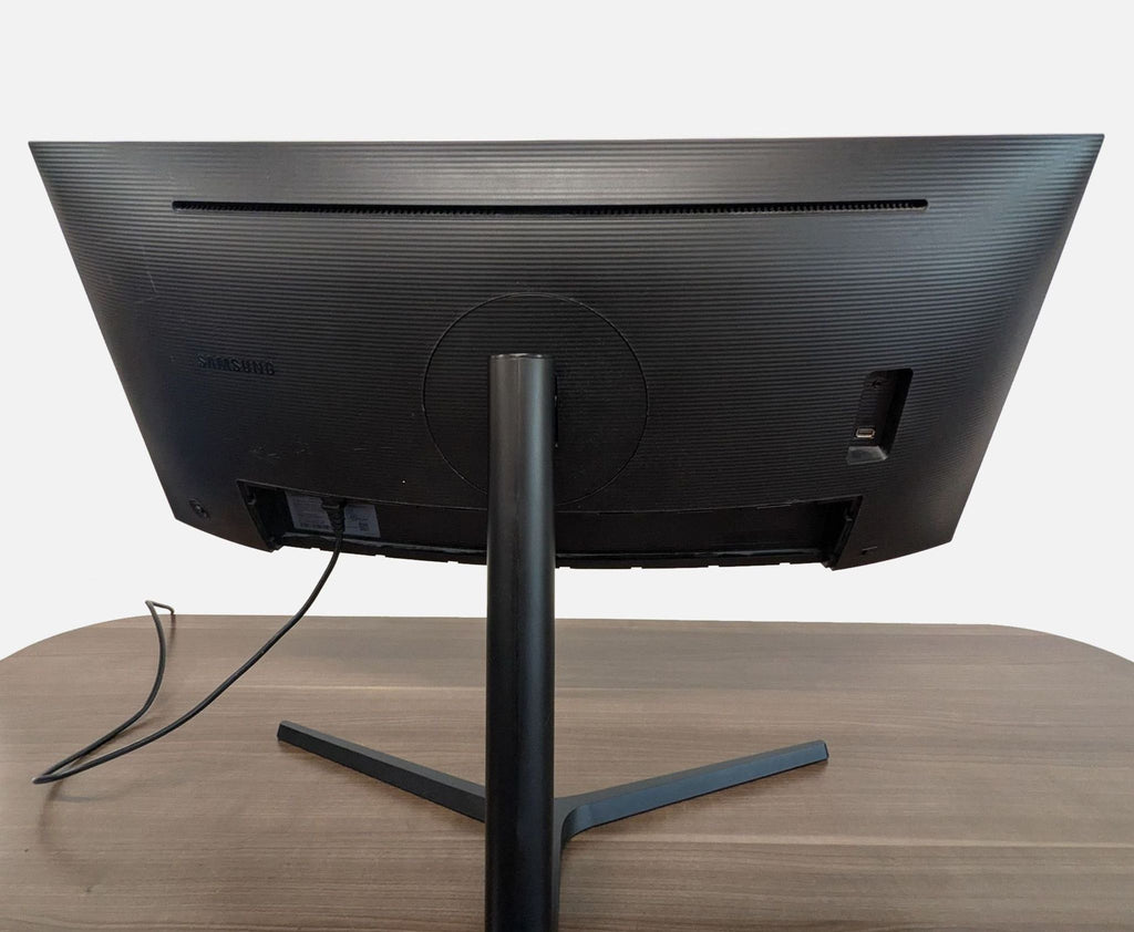 Rear view of Samsung UltraWide curved monitor displaying its ports, textured back, and solid Y-shaped base.
