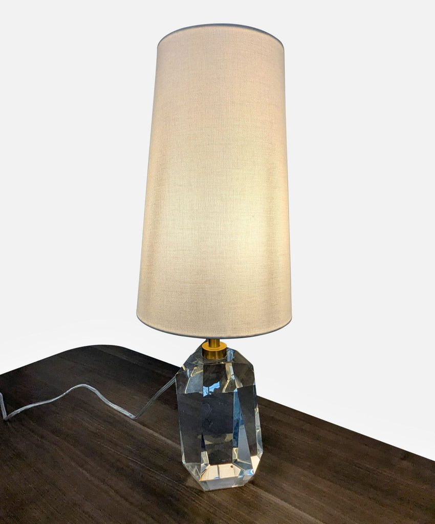 3. Table lamp in the Lighting category, with a tall linen shade and a sculpted crystal body, designed by Kelly Wearstler.