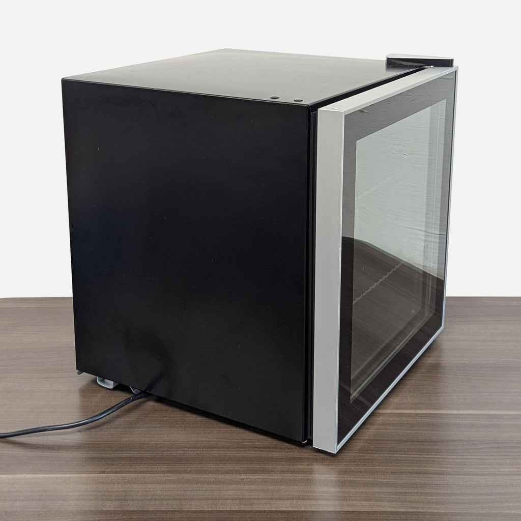 3. Side angle of the sleek Antarctic Star compact refrigerator, showing its modern design and glass front.