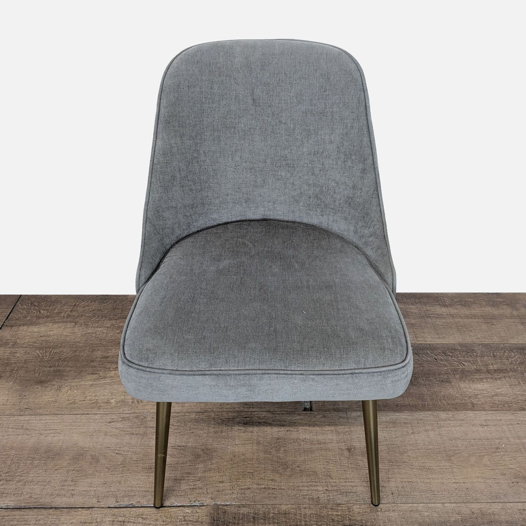 3. Angled front view of West Elm dining chair in performance grey velvet, featuring brass legs.