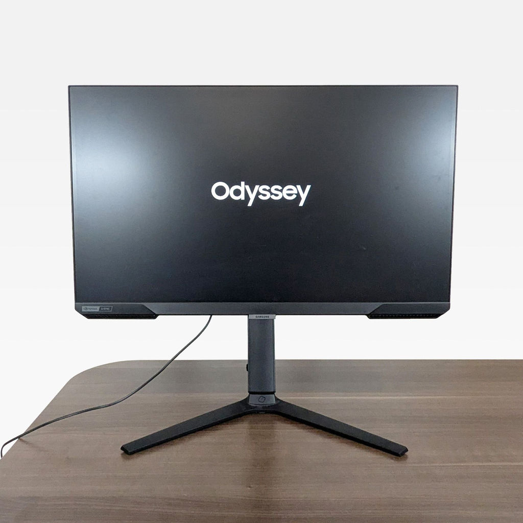 1. Front view of a Samsung 27-inch Odyssey gaming monitor with a flat screen, on a desk.