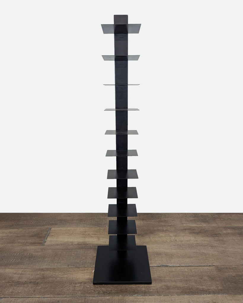 1. Tall, modern black bookshelf by Reperch with slim, square shelves for a floating book display effect.