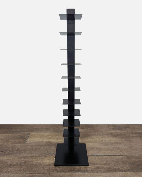 1. Tall, modern black bookshelf by Reperch with slim, square shelves for a floating book display effect.