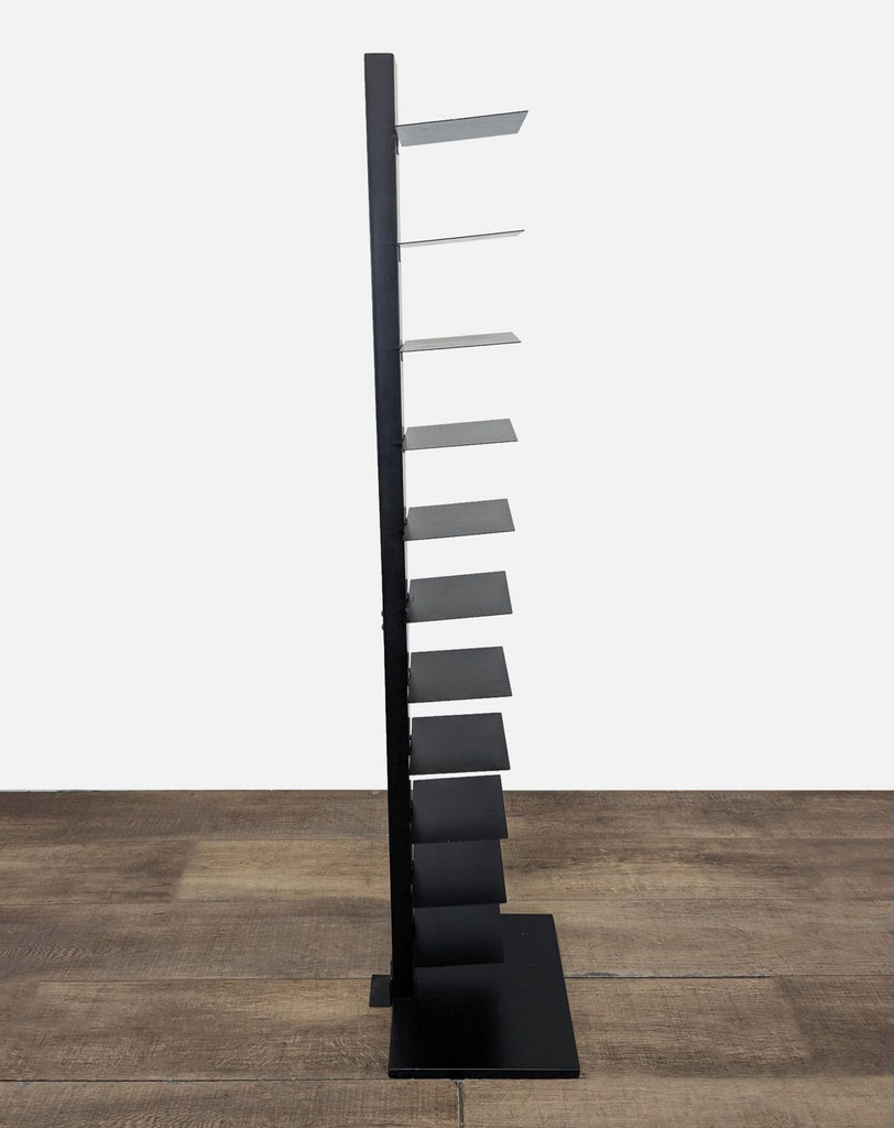 2. Side view of a Reperch bookshelf with minimal shelves, designed for adjustable height and invisible stacking.