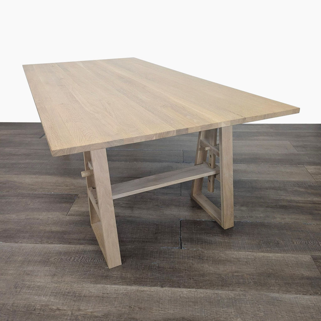 2. Adjustable height wooden trestle desk by Industry West, featuring a sturdy, minimalist design.  