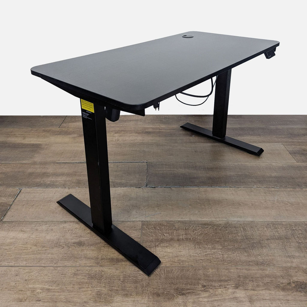 2. Side view of Maidesite desk featuring adjustable height controls and built-in cable management system.