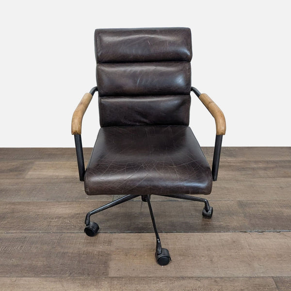 1. Reperch chair featuring a channel tufted back, wood armrests, and caster wheels, viewed from the front.