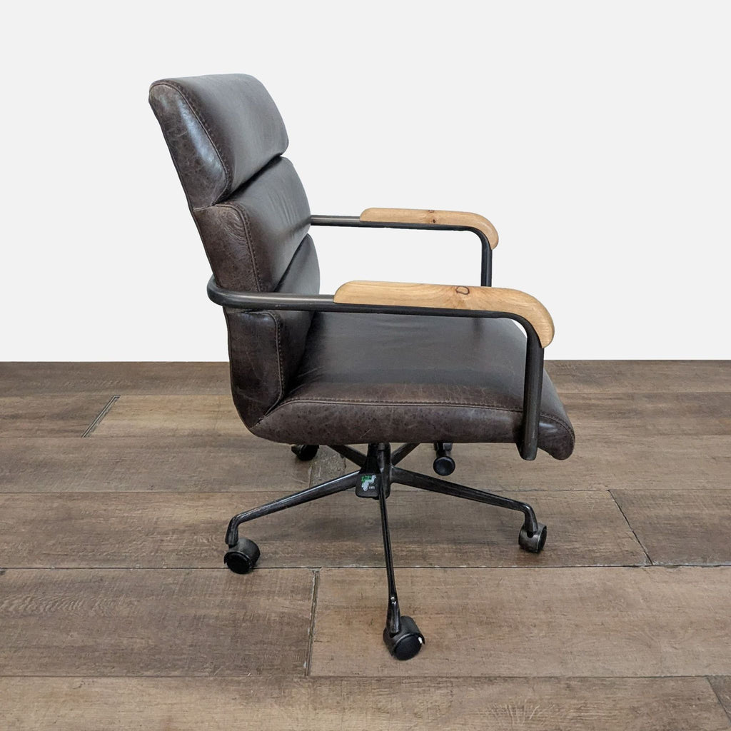 2. Side profile of Reperch chair showing channel tufted back, wood armrests, and rolling caster wheels.
