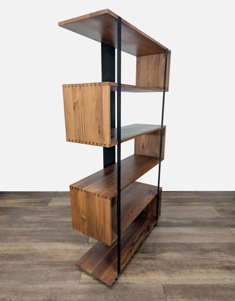 2. Side view of a Crate and Barrel zigzag bookshelf, featuring walnut shelves and bold black steel accents.