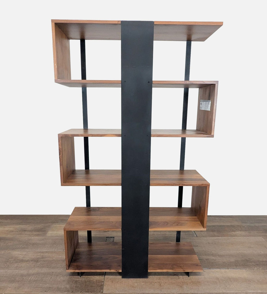 3. S-shape walnut bookshelf by Crate and Barrel with black steel supports, striking geometric open architecture.