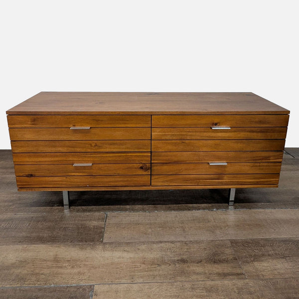 1. Modern CB2 dresser with six drawers, walnut finish, and metal handles on wood legs, front view.