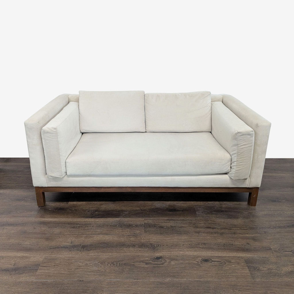 1. Apt2B loveseat with cleanable, breathable hypoallergenic fabric and reversible, detached cushions, front view.  