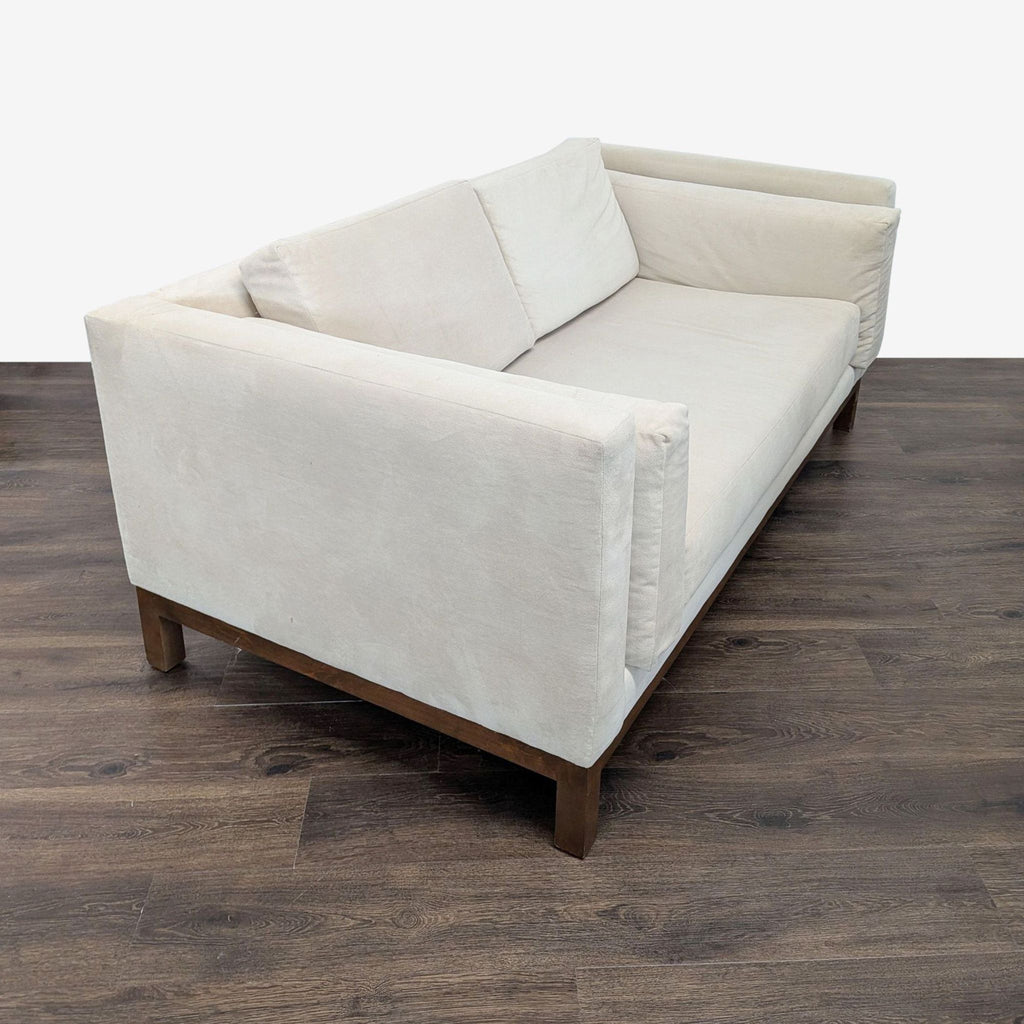 2. Angled side view of Apt2B loveseat, showing flippable detached cushions and modern straight arms.  