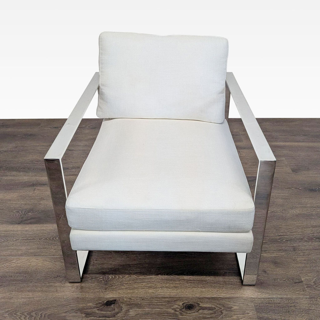 Modern white upholstered lounge chair with polished metal arms and frame, by Restoration Hardware.  