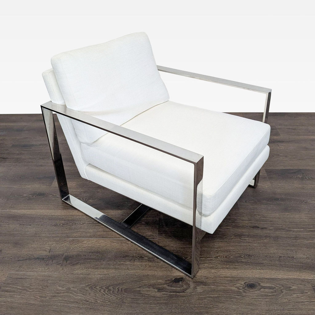 Restoration Hardware lounge chair featuring sleek white cushions and a sturdy polished metal frame.